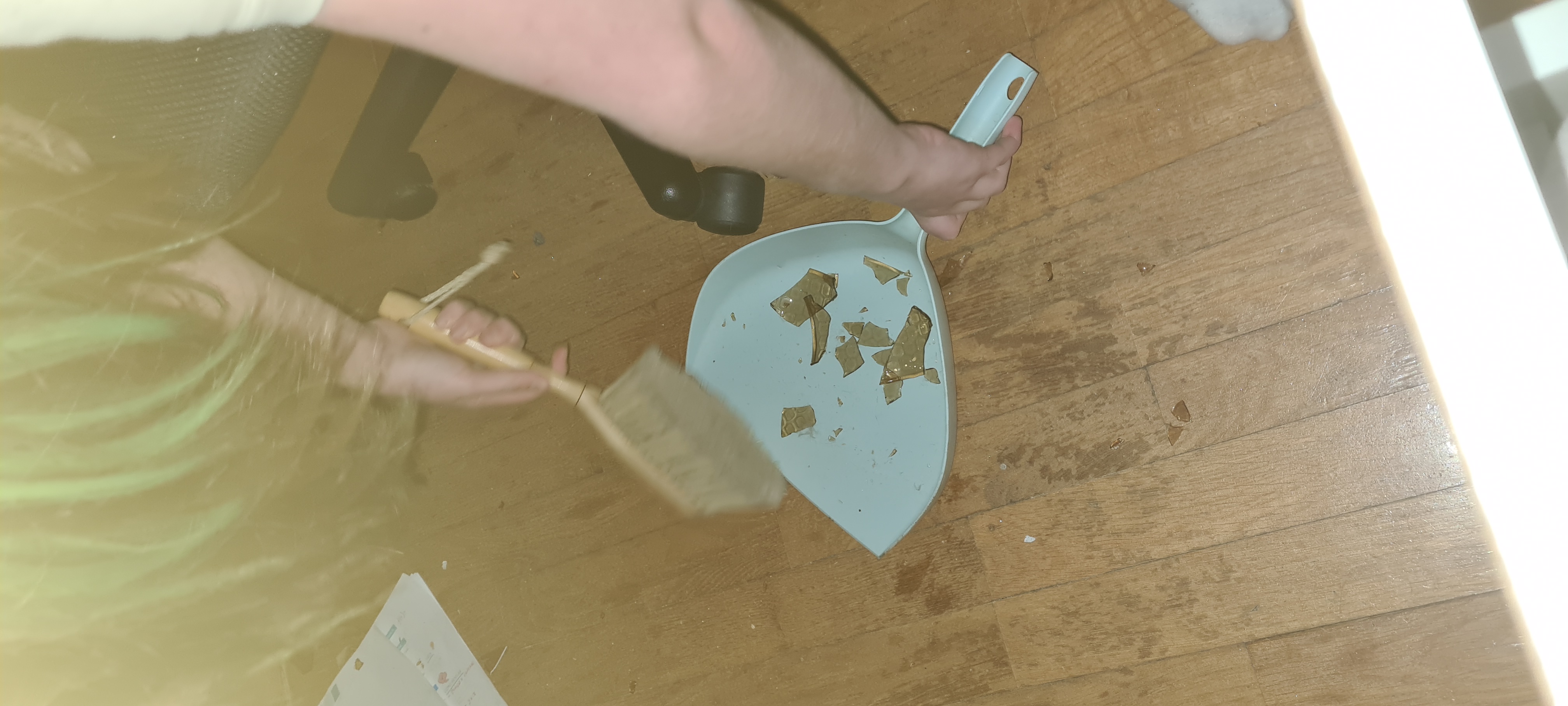 My personal maid is cleaning up a broken mug. It's so good that it's not even my house or my mug ,')